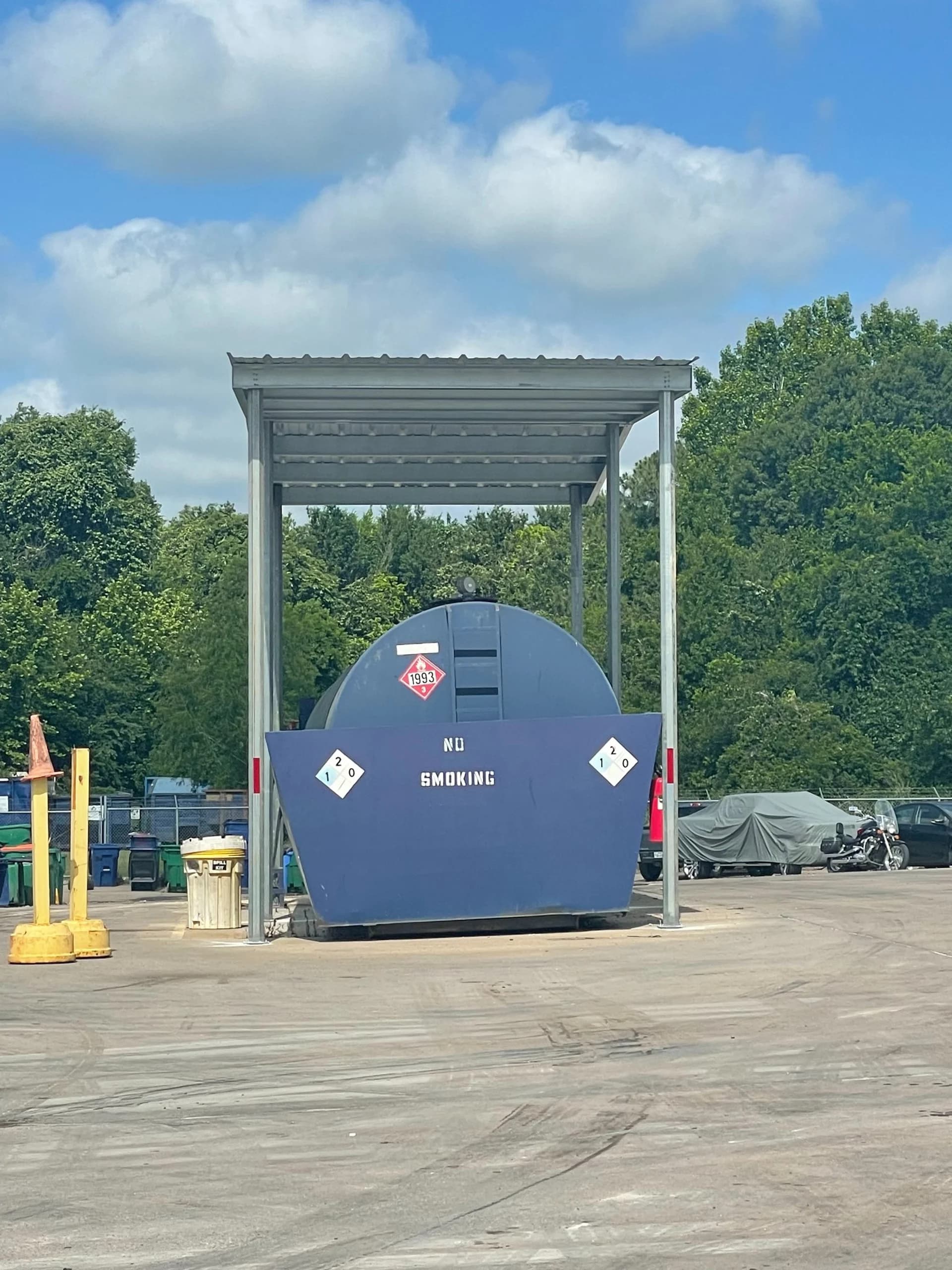 Open metal shelter covering equipment in an industrial yard