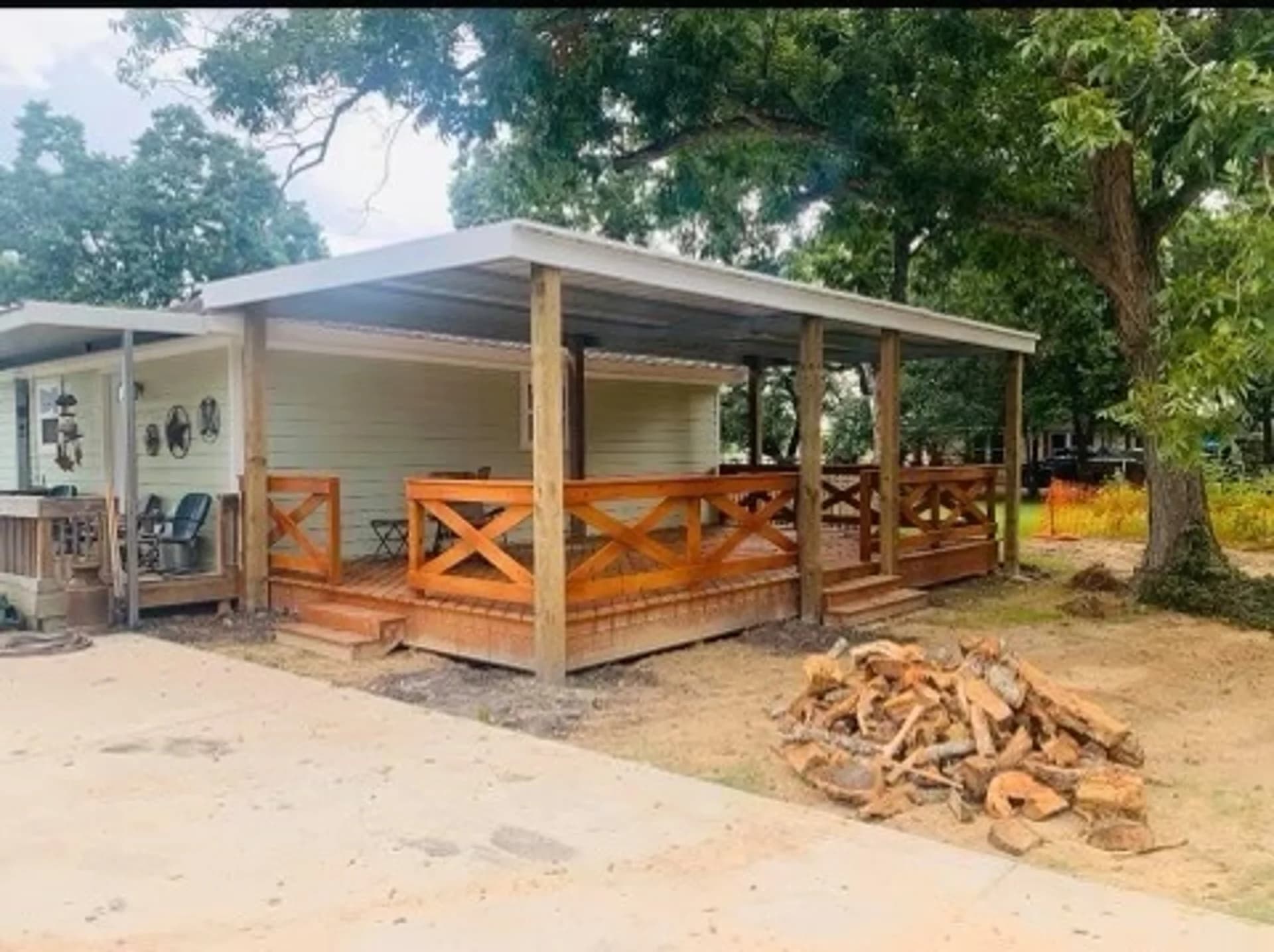 Residential wooden deck with a corrugated metal roof