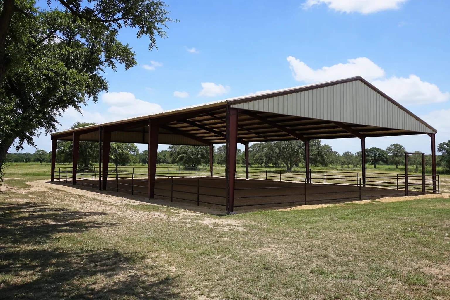 Wide-span metal riding arena on a Texas ranch