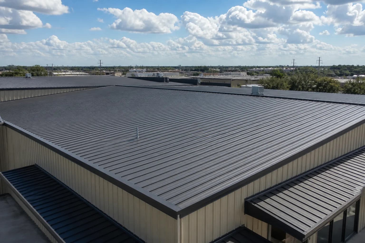 Finished standing-seam commercial metal roof on a Houston building